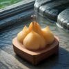 吾色内容策划刘湄的工作照，她正在整理色彩情绪板与视觉参考素材，桌面摆放着精心排列的色卡与设计草稿，展现出细腻的视觉感知力